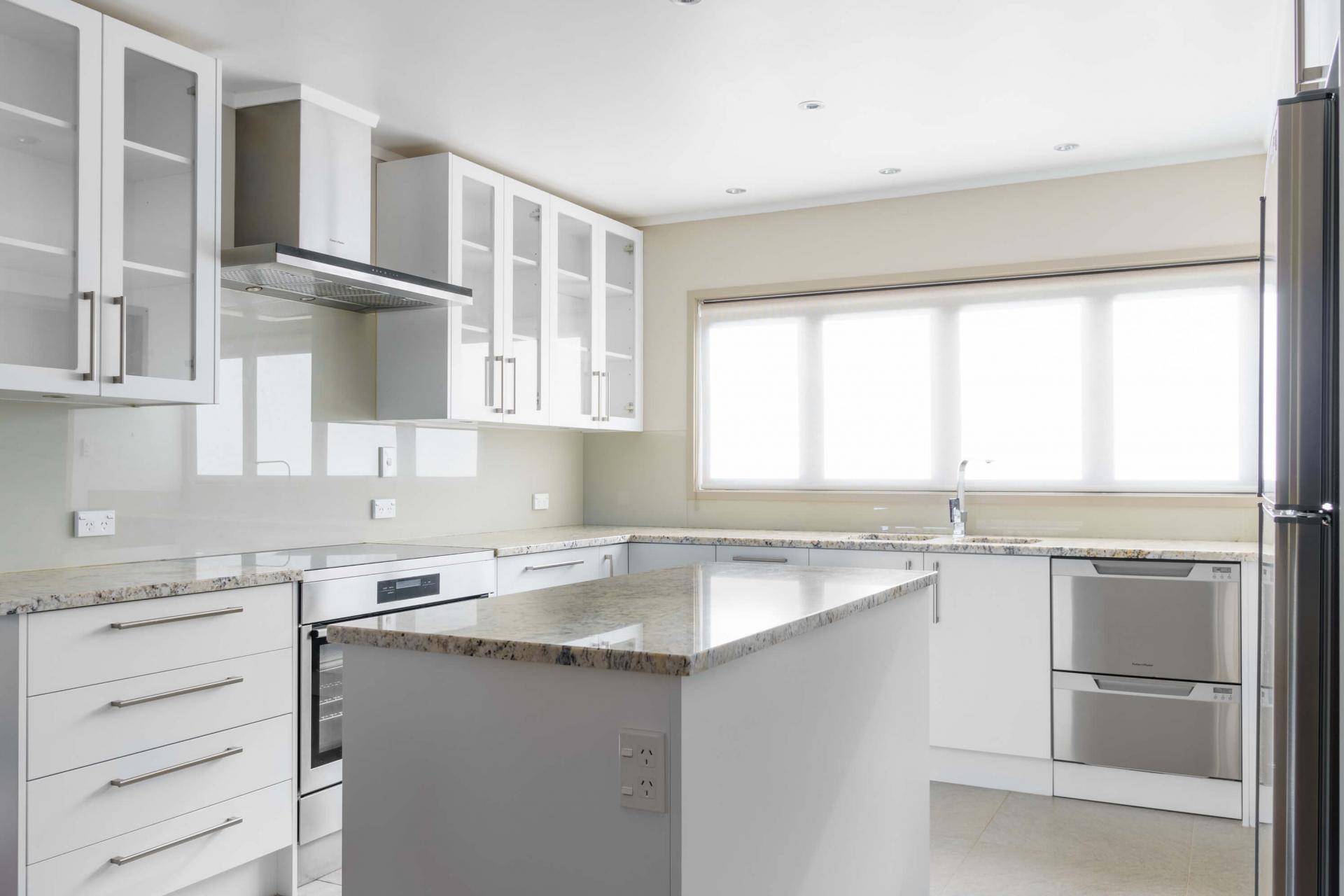 New white kitchen with center bench